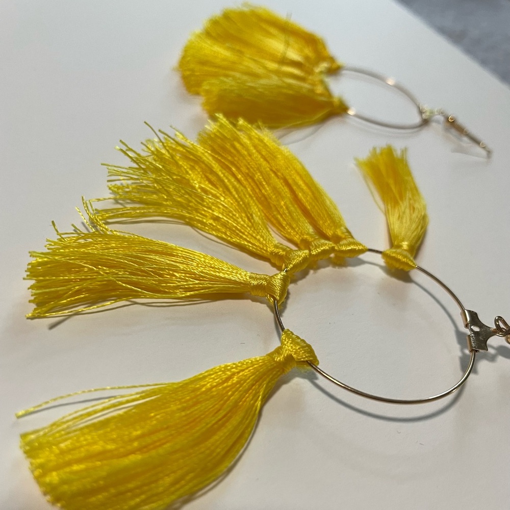Yellow tassel hoop earrings